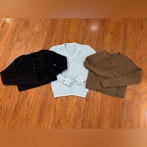 Three John Galt Sweaters - Black, Light Blue, and Brown Sweaters